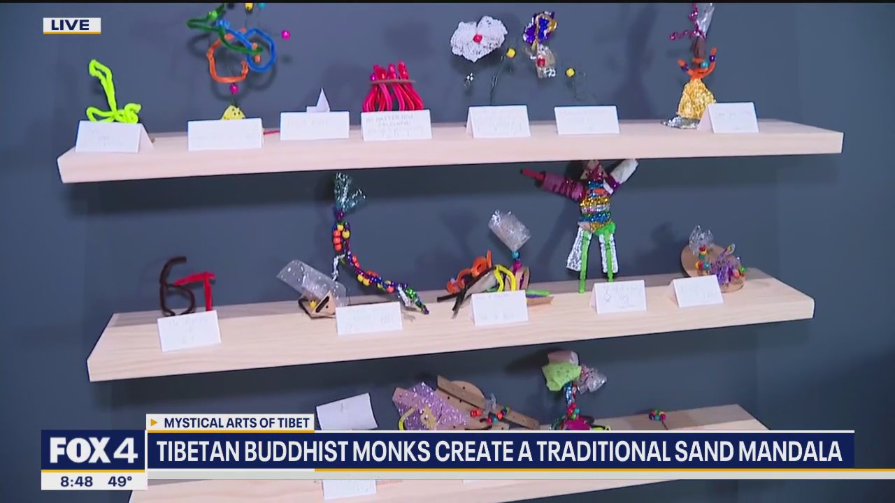 Buddhist monks create traditional sand mandala